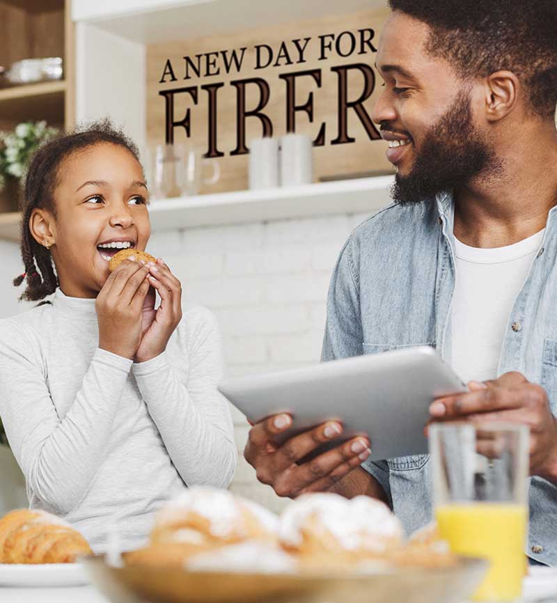 Image of Dad and Daughter Eating Treats